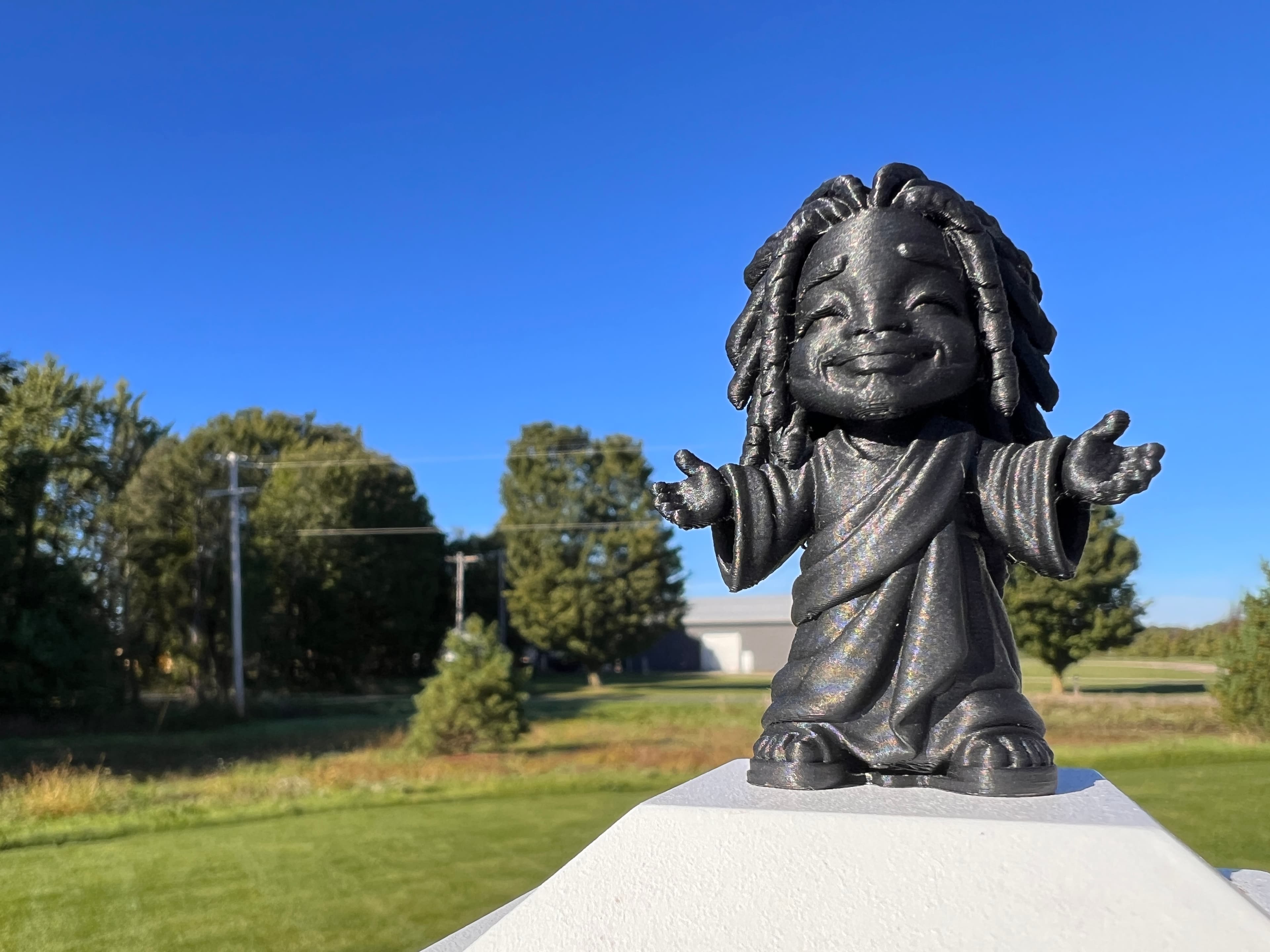 Tiny Black Jesus sculpture