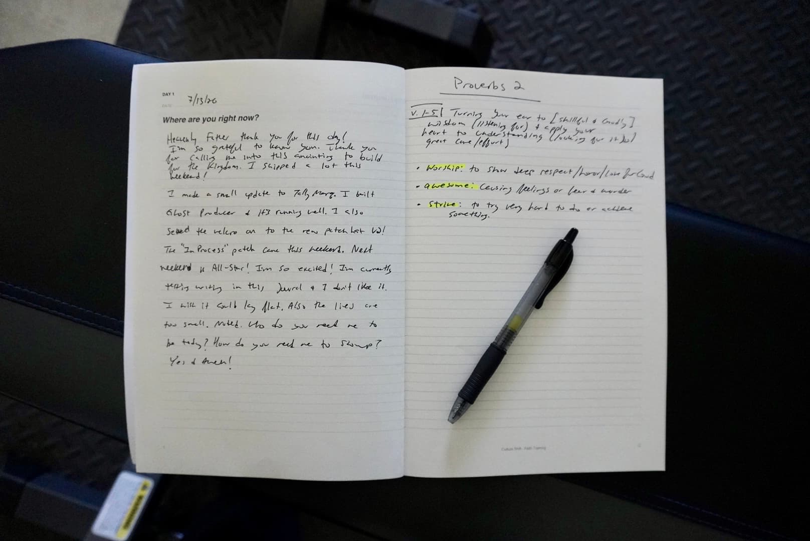An open Faith Training Journal showing handwritten reflections
